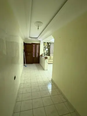 an empty room with a hallway with a tile floor at Luxury apartment 100 m2 in Mohammedia in Mohammedia