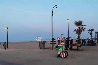 a small food cart on the beach with a group of people at Charming Modern Studio near Corniche Mohammedia in Mohammedia