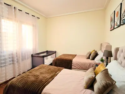 a bedroom with two beds and a window at Seaside 3 bedrooms apartment in Mansouria near Sablette Beach Mohammadia in Pont Blondin