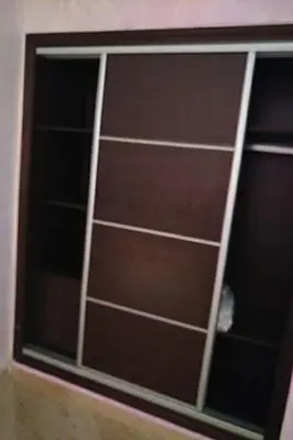 a sliding glass door with a window in a room at Marina beach in Mohammedia