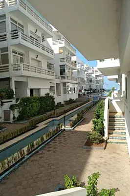a view of a street with some buildings at Marina beach in Mohammedia