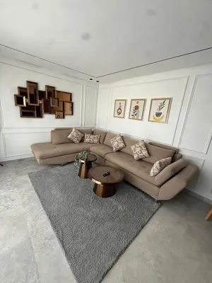 a living room with two couches and a rug at Metropoleparc luxury apparthotel in Casablanca