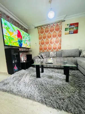 a living room with a couch and a table at Résidence Adam in Casablanca