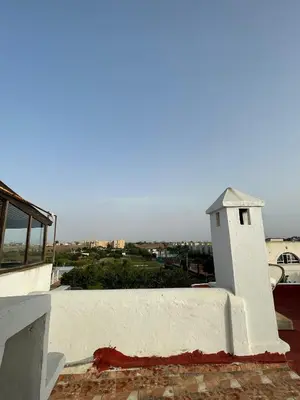 a small white building on top of a building at Apartment in a waterfront complex in Casablanca