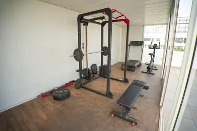 a gym with several tread machines in a room at Cedar Stays Appartement 1 chambre salon, parking, climatisation, Wifi, balcon in Casablanca