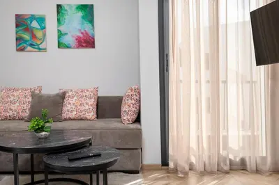 a living room with a couch and a table at Modern & Calm Studio in Casablanca
