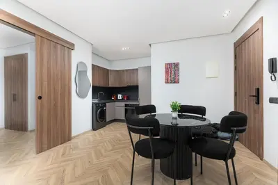 a kitchen and dining room with a table and chairs at Modern & Calm Studio in Casablanca