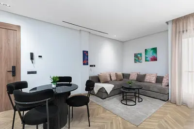 a living room with a couch and a table at Modern & Calm Studio in Casablanca