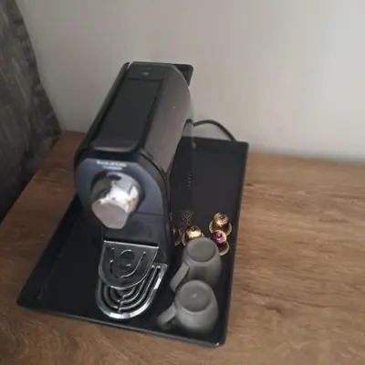 a black item sitting on top of a table at Zen Stay Appart in Casablanca
