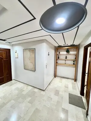 a large room with a ceiling with a large light fixture at Le repos parfait in Casablanca