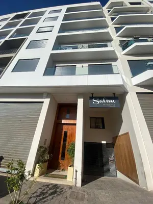 a building with a sign on the front of it at Cosy Maarif in Casablanca