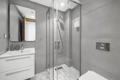 a bathroom with a shower and a sink at Cozy studio on the Casablanca Ain Diab corniche in Casablanca