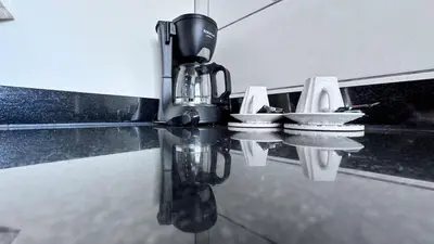 a coffee maker sitting on top of a kitchen counter at Cozy apartment Sea view & Comfort in Mohammedia