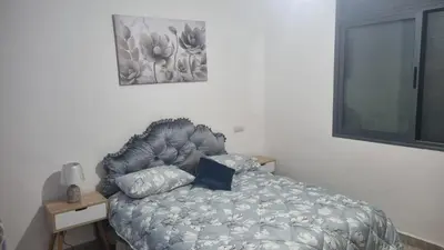 a bedroom with a bed and a picture on the wall at ALTIS Immo Authentic House in Casablanca