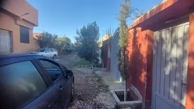 a car parked in a driveway next to a house at ALTIS Immo Authentic House in Casablanca