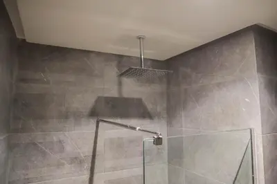 a shower with a glass door in a bathroom at R108- Gorgeous & Cosy Aprt with Wifi, Parking and Gym at the heart of Bourgogne in Casablanca-Port
