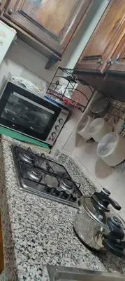 a kitchen counter top with a stove top oven at Appartement au centre rabat dyour jamaa in Rabat