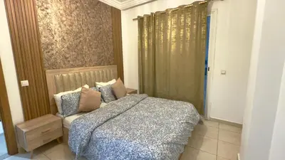 a bedroom with a bed and a window at Super appart vue sur mer in Rabat