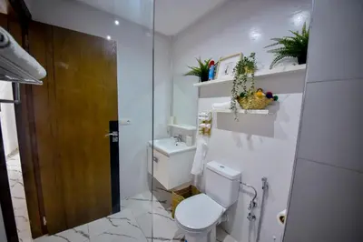 a white bathroom with a toilet and a sink at Atlantic View in Casablanca