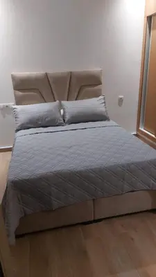 a large bed in a bedroom with at Sidi Rahal beach apartment Heaven beach in Sidi Rahal
