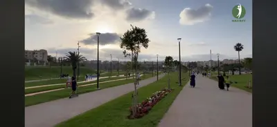 a park with people walking on a sidewalk at Hay laymoun oulfa casablanca Appartement laimoun in Anfa