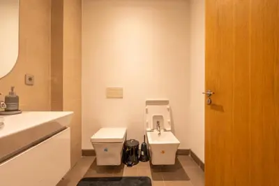 a bathroom with a toilet and a sink at Luxury Apartment Anfaplace style & elegant in Casablanca