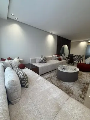 a living room with two couches and a table at Cosy cocon central in Le Polo