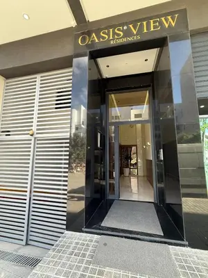 an entrance to an office building with a glass revolving door at Cosy cocon central in Le Polo