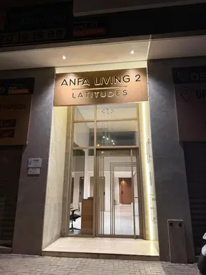 a entrance to a building with a sign for an area living furniture at Cozy and chic apartment in Casablanca in Casablanca