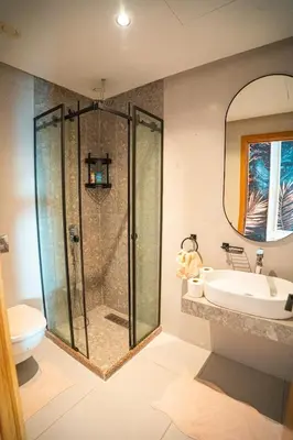 a bathroom with a shower and a sink at Skyline View Luxury Private Parking - Netflix in Casablanca
