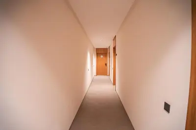 a hallway with white walls and a long corridor at Skyline View Luxury Private Parking - Netflix in Casablanca