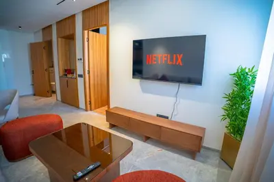 a living room with a television on a wall at KeyLiving 501 3 pers Emplacement Top Wifi in Casablanca