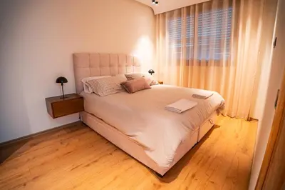 a bedroom with a large white bed with a window at KeyLiving 501 3 pers Emplacement Top Wifi in Casablanca