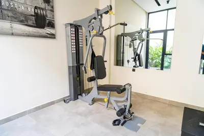 a gym with cardio equipment in a room at CFC Skyline View Luxury Private Parking - Netflix in Casablanca