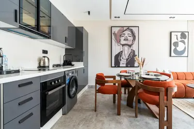 a kitchen and dining room with a table and chairs at CFC business, Coworking, gym, self check-in in Casablanca