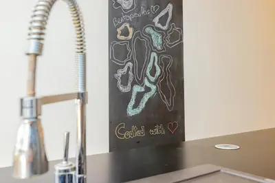 a chalk board on the wall above a kitchen sink at Luxury central Apartment - 3BR - Flipper - Parking in Casablanca