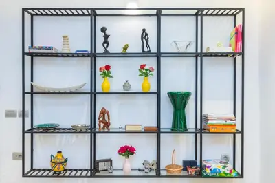 a shelf with vases and other items on it at Luxury central Apartment - 3BR - Flipper - Parking in Casablanca