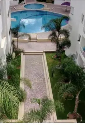 an overhead view of a swimming pool in a building at Magnifique Appartement à Louer C14 Jnane Dalya in Bouznika
