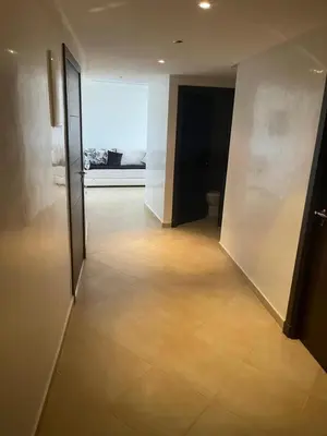 an empty hallway with a large window in a building at Superbe Appartement à Louer C14 Jnane Dalya in Bouznika