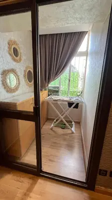 a small room with a window and a bed at Appartement Moderne et Lumineux in Rabat