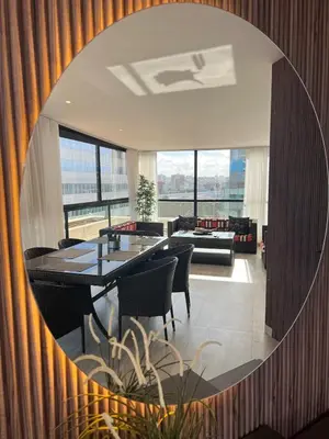 a living room with a table and chairs and a mirror at Beautiful Ocean view Marina Casablanca in Casablanca