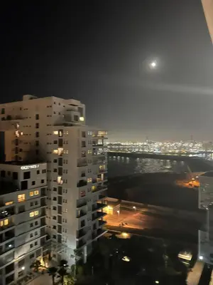 a view of a city at night from a building at Stunning Marina high floor ocean view in Casablanca