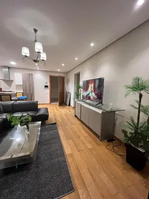 a living room with a couch and a table at Stunning Marina high floor ocean view in Casablanca