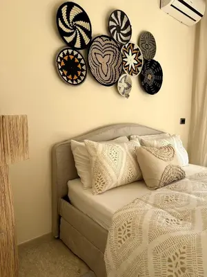 a bedroom with a bed with plates on the wall at Bohemian Oasis in Casablanca