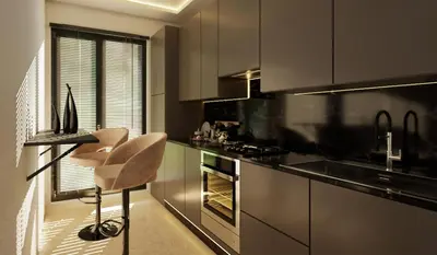 a kitchen with a counter and a chair in it at Appartement spacieux et calme - ain chock CASAblanca in Casablanca