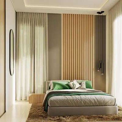 a bedroom with a bed with green pillows on it at Appartement spacieux et calme - ain chock CASAblanca in Casablanca