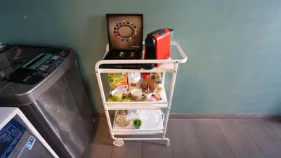 a small refrigerator with a phone on top of it at Cosy home in Casablanca