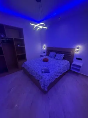 a purple bedroom with a bed with a purple ceiling at Modern Studio in Hay Riad All Comfort in Rabat