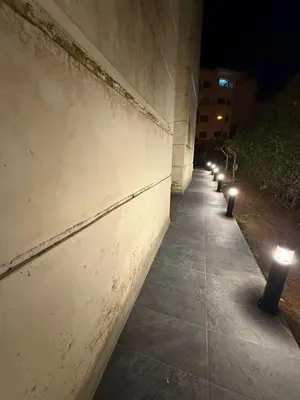 a row of candles on a sidewalk at night at Modern Studio in Hay Riad All Comfort in Rabat