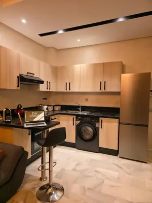 a kitchen with a washer and dryer in a room at apartment luxe dt7 in Casablanca